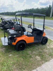 2019 E-Z-GO RXV orange electric golf cart side view