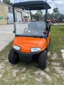 2019 E-Z-GO RXV orange electric golf cart rear three-quarter view