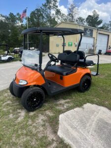 2019 E-Z-GO RXV orange electric golf cart front three-quarter view